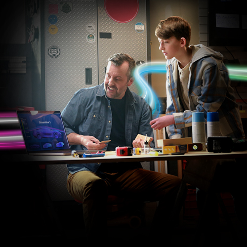 father and son on laptop